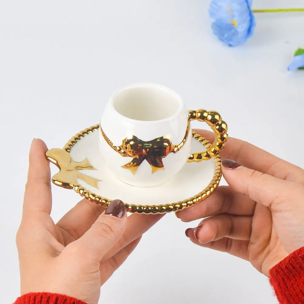 Xícara de Chá de Porcelana com Laço e Alça Dourada 90ml